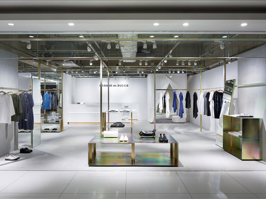 Schemata Architects refits Japanese clothing store with petrol-hued display structure