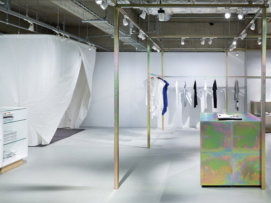 Schemata Architects refits Japanese clothing store with petrol-hued display structure