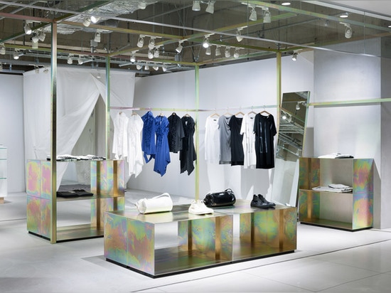 Schemata Architects refits Japanese clothing store with petrol-hued display structure