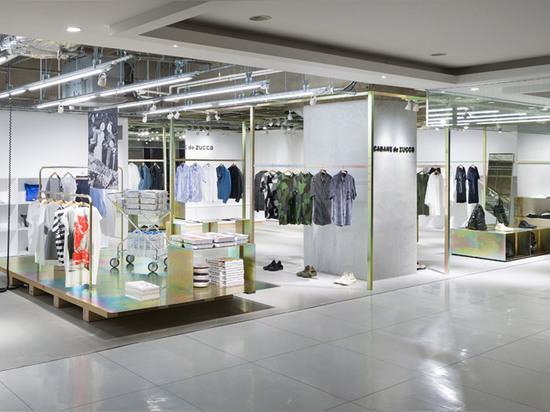 Schemata Architects refits Japanese clothing store with petrol-hued display structure