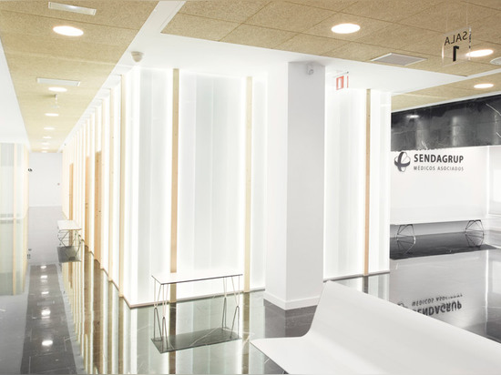 Frosted glass and dark marble walls partition Sendagrup Medical Centre by Pauzarq