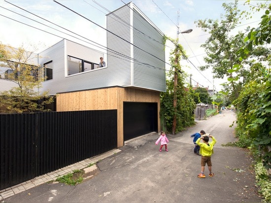 Montreal home updated with corrugated metal cladding and a vibrant staircase