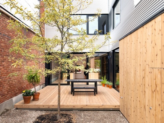 Montreal home updated with corrugated metal cladding and a vibrant staircase