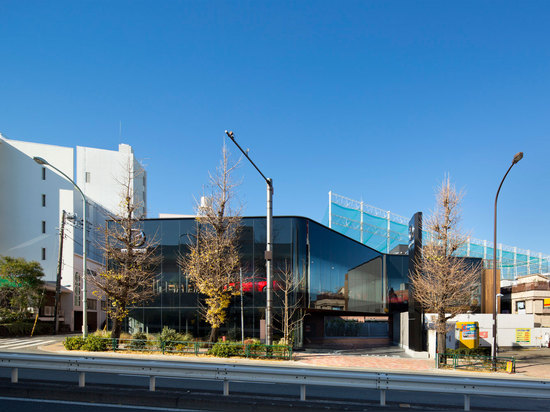 Mazda Showroom by Suppose Design Office pairs streamlined glazing with wood