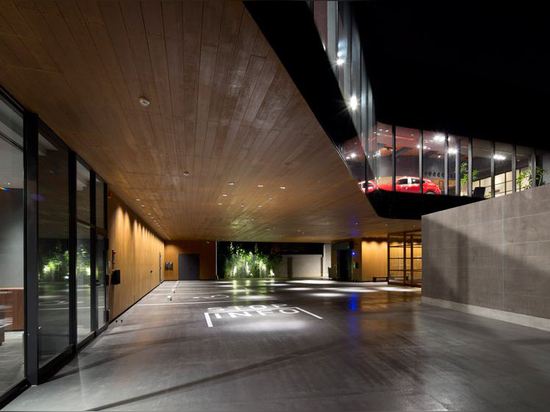 Mazda Showroom by Suppose Design Office pairs streamlined glazing with wood