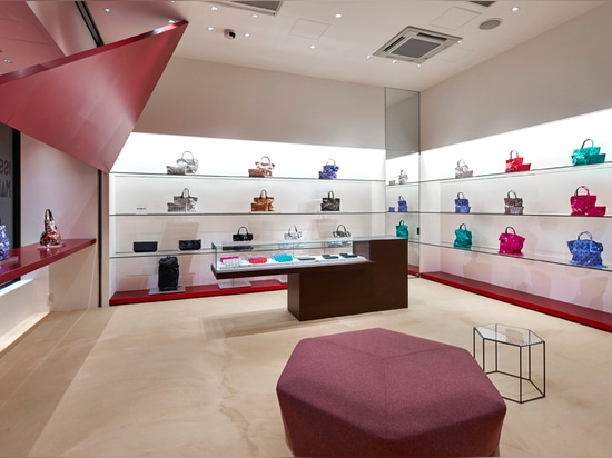 Tokujin Yoshioka installs giant red triangles for Tokyo Issey Miyake store