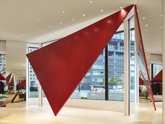 Tokujin Yoshioka installs giant red triangles for Tokyo Issey Miyake store