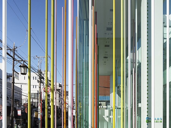 The nine-meter-tall sticks mimic a rainbow shower