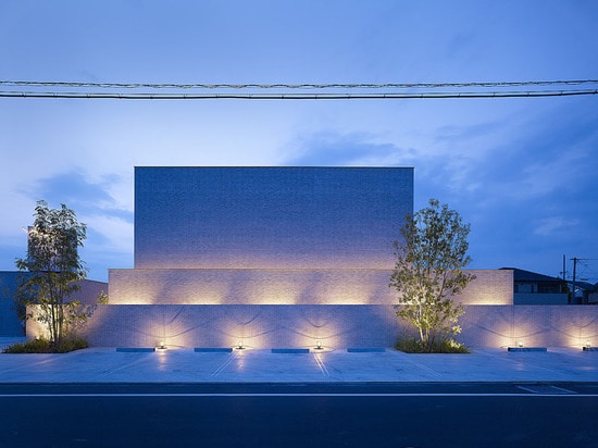 The building illuminated at night.