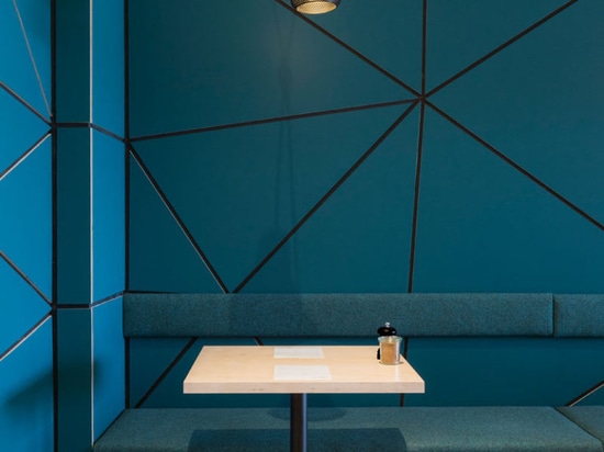 The interior of this cafe is covered in geometric panel shapes