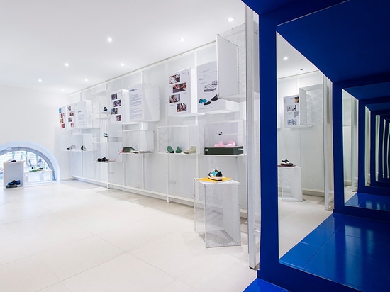 miklós kiss encases budapest footwear store in brilliant white metro tiles