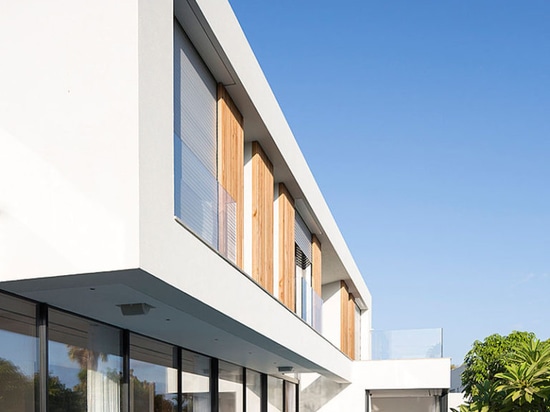 Large sliding glass walls give this house easy access to the pool