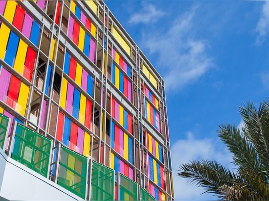 Stainless steel mesh facade with painted architectural mesh by Haver & Boecker.