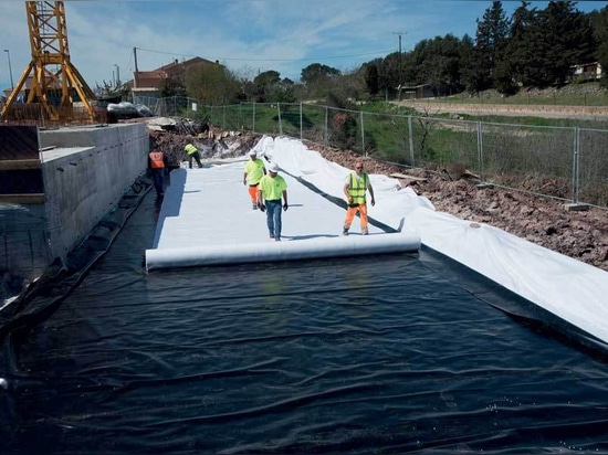 laying the geomembrane and geotextile