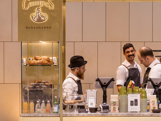 woods bagot positions brass coffee kiosk inside sydney tower