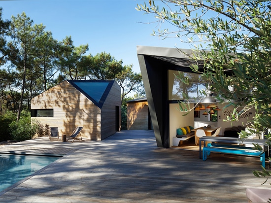 atelier du pont's award-winning poolside cabin is hidden in the pine groves of france