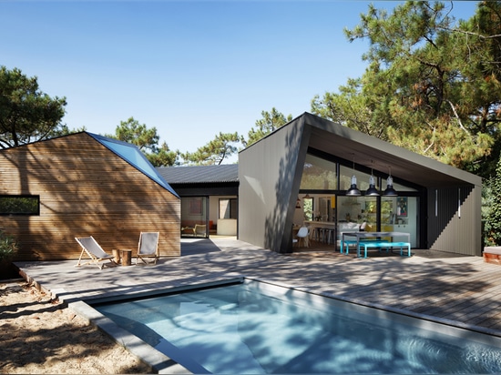 atelier du pont's award-winning poolside cabin is hidden in the pine groves of france