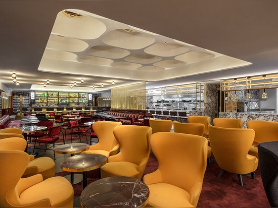 tom dixon's le drugstore brasserie encapsulates sixties glamor in paris