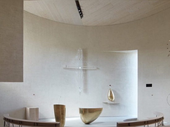 Light glides softly inside this cylindrical modern church in the Czech Republic