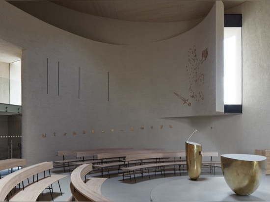 Light glides softly inside this cylindrical modern church in the Czech Republic