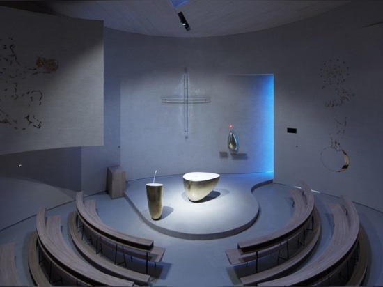 Light glides softly inside this cylindrical modern church in the Czech Republic