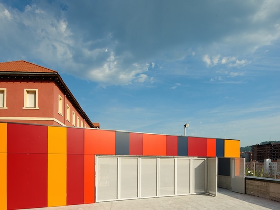 foraster's colorful rehabilitation swaps the standard cement aspects of a school in bilbao