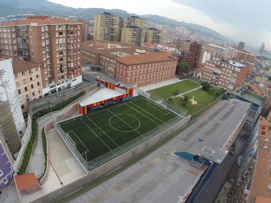 foraster's colorful rehabilitation swaps the standard cement aspects of a school in bilbao