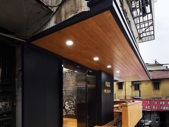 This New Coffee Shop Was Inserted In An Older Apartment Building In China