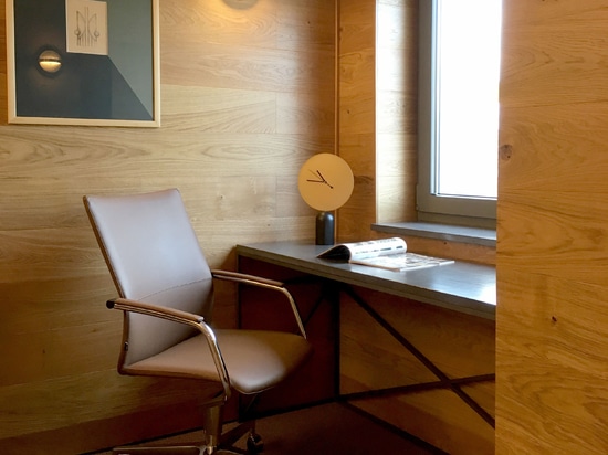 Executive Office interior design featuring black concrete and wood