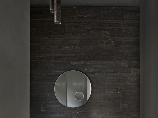 Wall in Pietra d'Avola Lithoverde, Archimede mirror, Adda basin, Silo pendant lamp, Urano sphere lamp, all by Salvatori