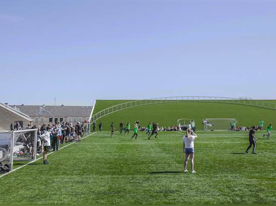 Bjarke Ingels goes back to school, revamps his old alma mater with a new gymnasium