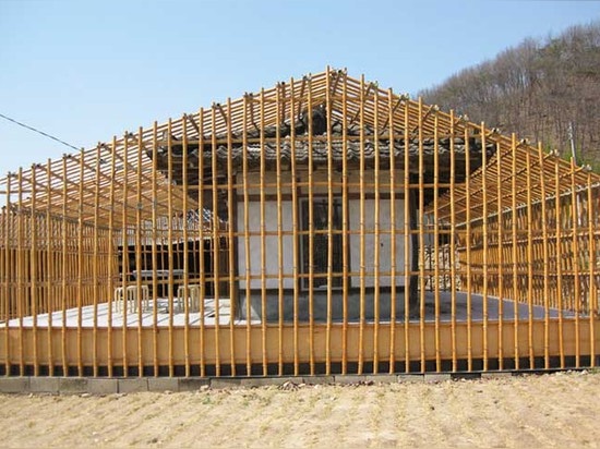 This abandoned 300-year-old home was turned into a cafe wrapped in a bamboo frame