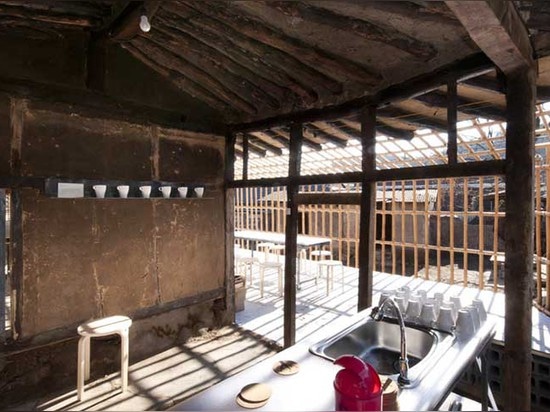 This abandoned 300-year-old home was turned into a cafe wrapped in a bamboo frame