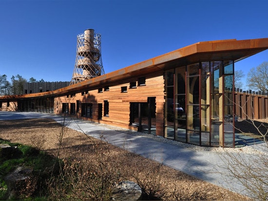 Environmental center by 24H Architecture is powered by the local forest