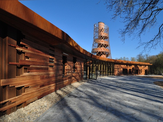 Environmental center by 24H Architecture is powered by the local forest