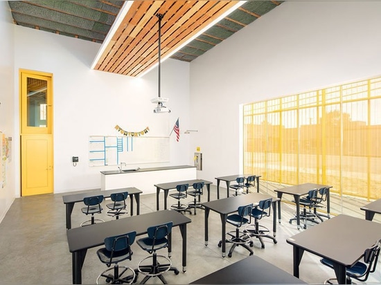 brooks + scarpa design curved yellow charter school in south los angeles