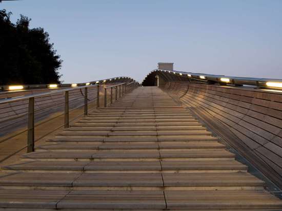 Gateway Villetaneuse footbridge unfurls like a leaf over train tracks outside Paris