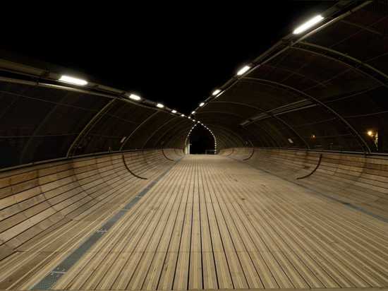 Gateway Villetaneuse footbridge unfurls like a leaf over train tracks outside Paris