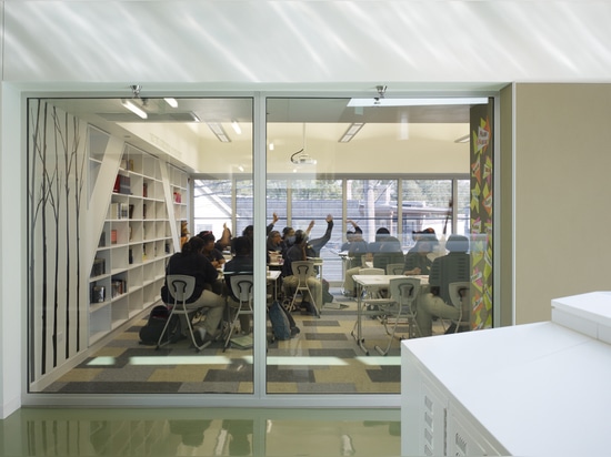 Interior view from the corridor looking through a classroom