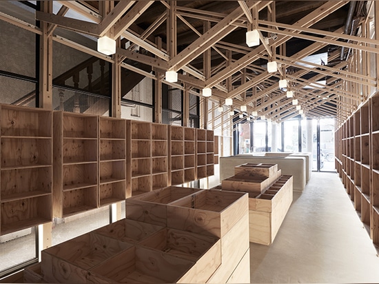 inverted trusses inserted inside historic dry-goods store in taiwan