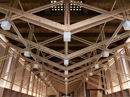 inverted trusses inserted inside historic dry-goods store in taiwan