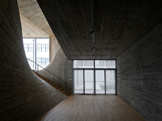 archi-union bends concrete stairwell in fab union space