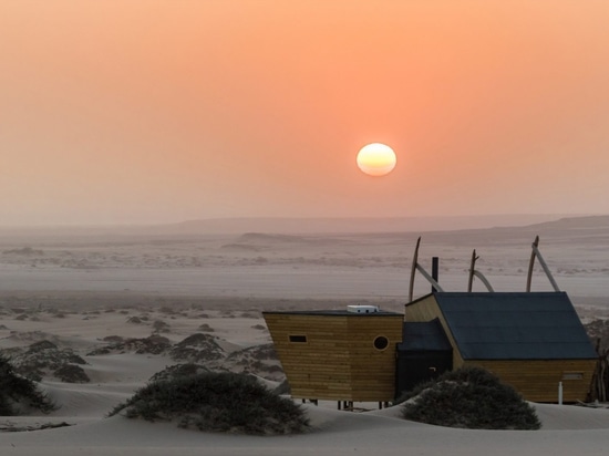 Shipwreck Lodge's wooden cabins evoke ships washed up on Namibia's Skeleton Coast