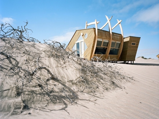 Shipwreck Lodge's wooden cabins evoke ships washed up on Namibia's Skeleton Coast