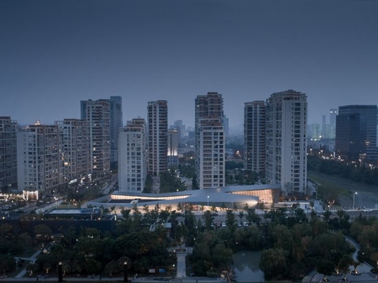 wenzhou culture club by lacime architects highlights the linear dynamics of the neighboring park