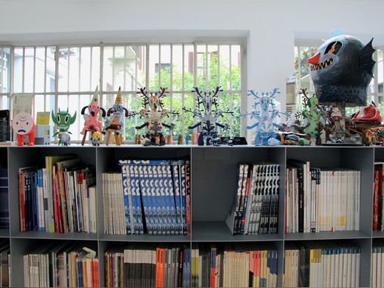 toys and characters line the book shelves