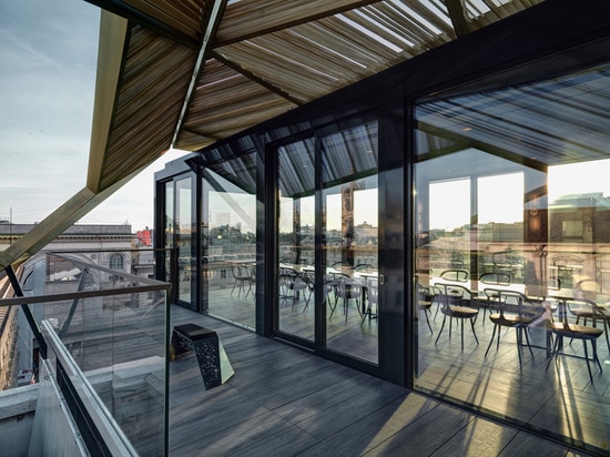 the restaurant is surrounded by foor-to-ceiling glazing