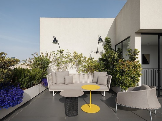 this holiday apartment in tel aviv features open rooftop terrace with shower on it