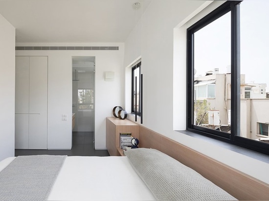 this holiday apartment in tel aviv features open rooftop terrace with shower on it