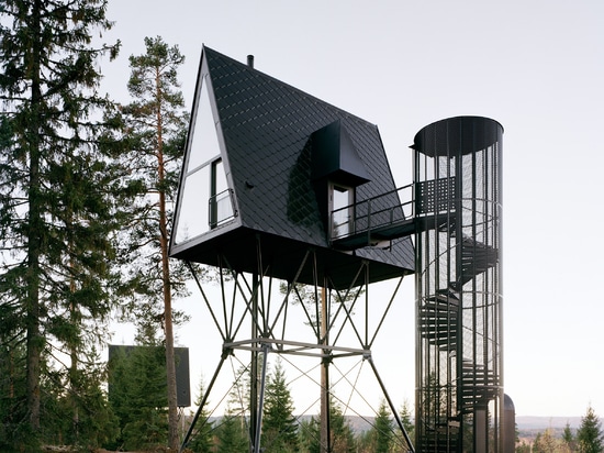 Espen Surnevik elevates pair of treetop cabins on stilts in Norwegian forest